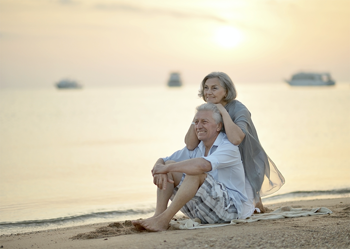 retired couple on beach